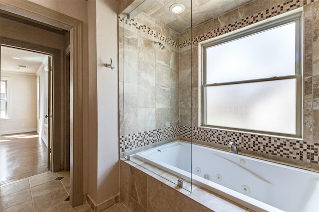 bathroom with tile patterned floors and baseboards