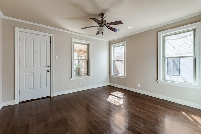 foyer featuring ceiling fan, crown molding, dark wood-type flooring, and baseboards