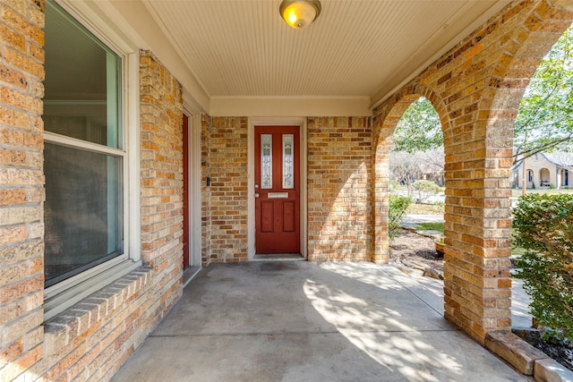 entrance to property with brick siding