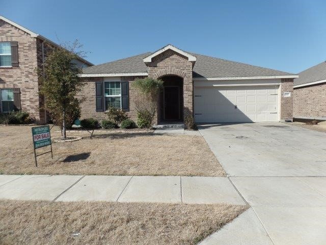 view of front of property with a garage, brick siding, driveway, and a shingled roof