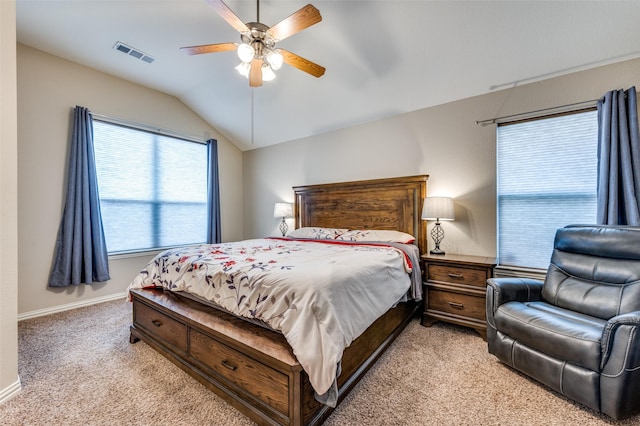 bedroom featuring visible vents, baseboards, lofted ceiling, ceiling fan, and light colored carpet