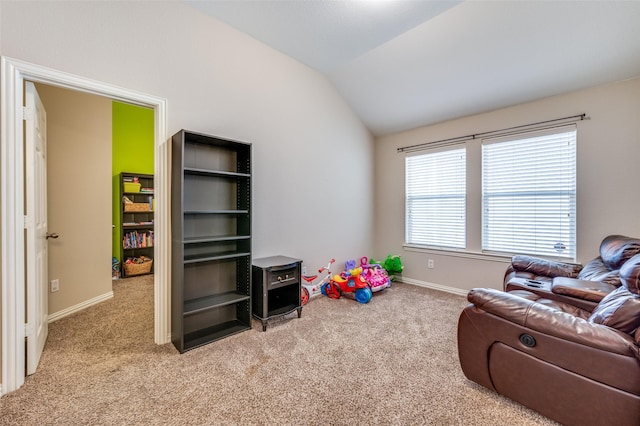 recreation room with baseboards, lofted ceiling, and carpet floors