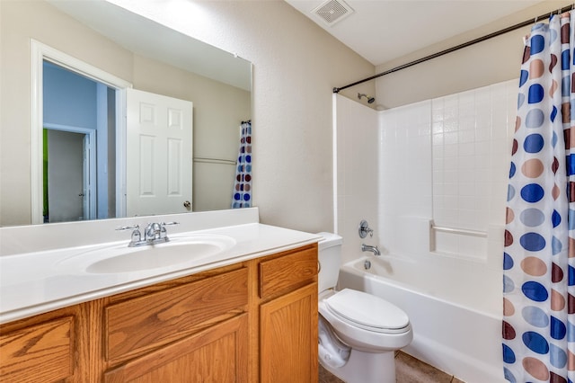 bathroom featuring visible vents, shower / tub combo, toilet, and vanity