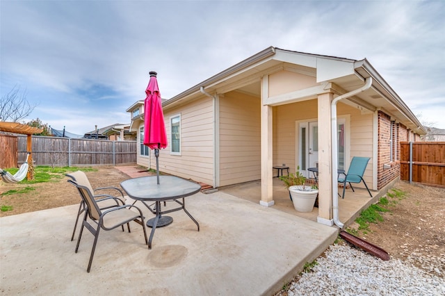 view of patio / terrace with outdoor dining area and a fenced backyard