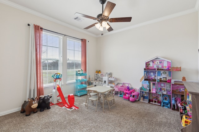 game room featuring carpet flooring, visible vents, crown molding, and ceiling fan