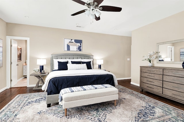 bedroom with visible vents, a ceiling fan, baseboards, and wood finished floors