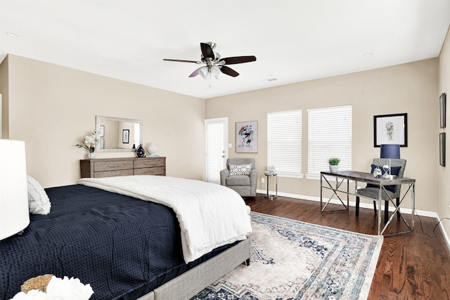 bedroom featuring a ceiling fan, baseboards, and wood finished floors