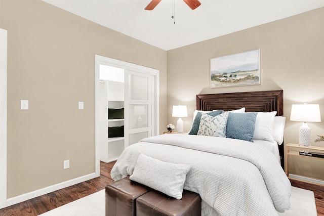 bedroom with baseboards, dark wood-style flooring, and ceiling fan