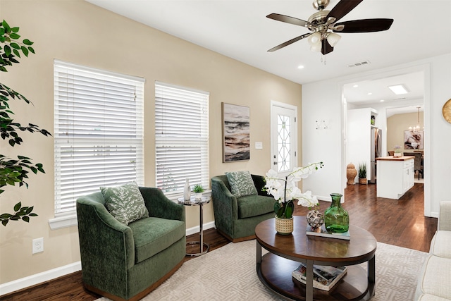 living area with wood finished floors, baseboards, visible vents, recessed lighting, and ceiling fan