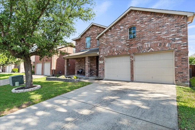 308 Highland Meadows Dr, Wylie, TX 75098 - traditional-style house featuring concrete driveway, a garage, brick siding, and a front yard