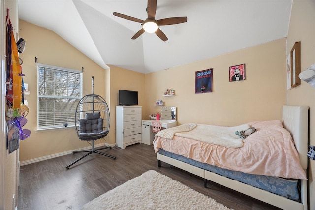 bedroom with a ceiling fan, vaulted ceiling, wood finished floors, and baseboards