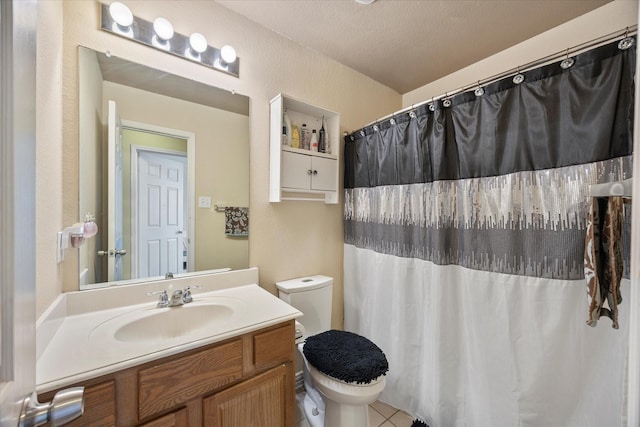 full bathroom with vanity, a shower with shower curtain, toilet, and tile patterned flooring