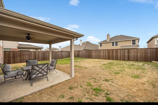 view of yard featuring a patio, a fenced backyard, and a ceiling fan