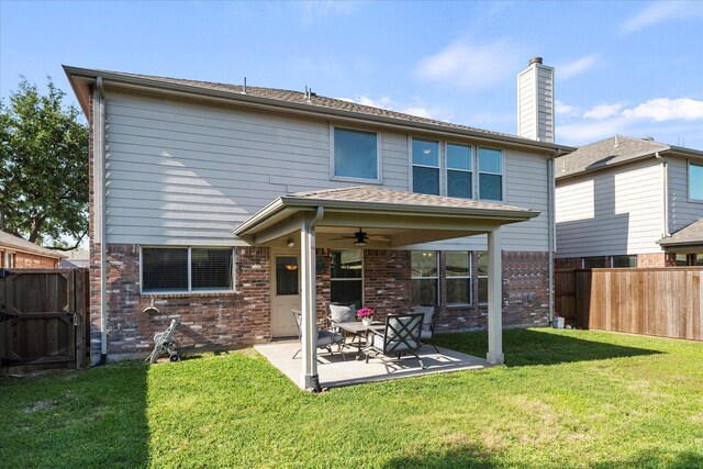 308 Highland Meadows Dr, Wylie, TX 75098 - rear view of house featuring a ceiling fan, a patio area, brick siding, and a chimney