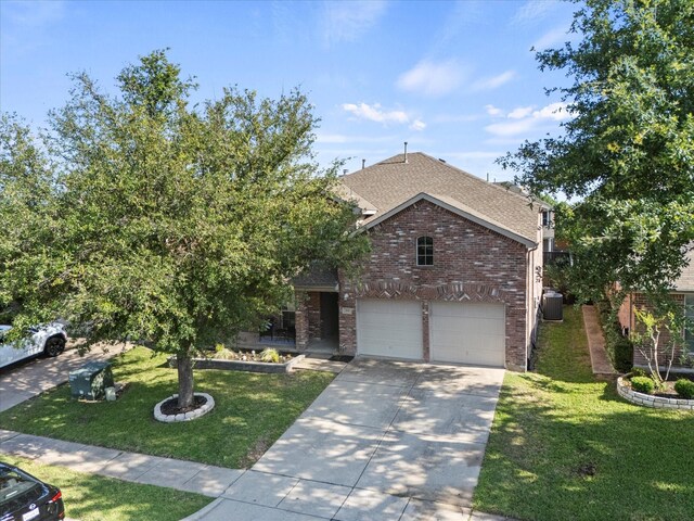 308 Highland Meadows Dr, Wylie, TX 75098 - view of front of property with roof with shingles, brick siding, concrete driveway, a front lawn, and a garage