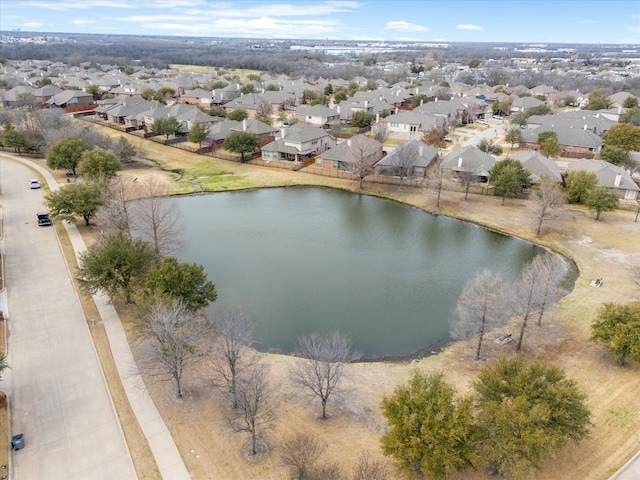 bird's eye view featuring a residential view and a water view