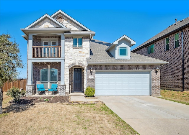 view of front of home featuring a balcony, fence, a shingled roof, concrete driveway, and a garage