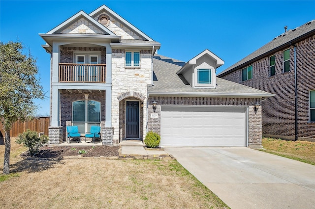 view of front of house featuring fence, concrete driveway, roof with shingles, a garage, and a balcony