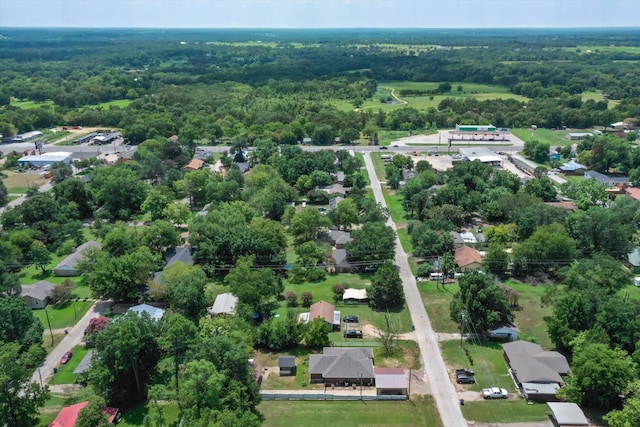 bird's eye view featuring a wooded view