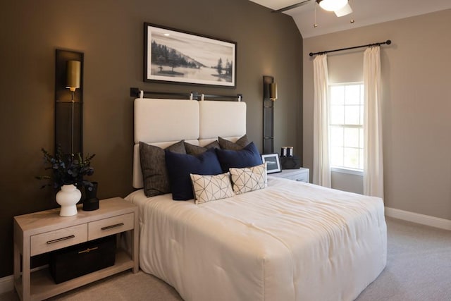 bedroom with baseboards, light carpet, and a ceiling fan