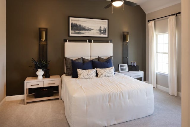 bedroom featuring vaulted ceiling, baseboards, and carpet floors