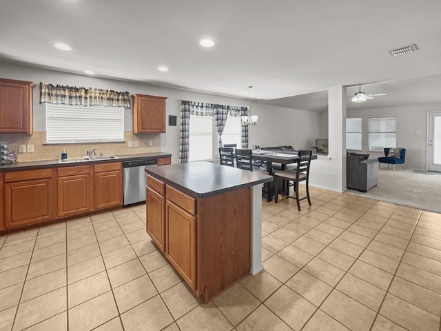 8828 King Ranch Dr, Cross Roads, TX 76227 - kitchen with dishwasher, dark countertops, a sink, light tile patterned floors, and recessed lighting