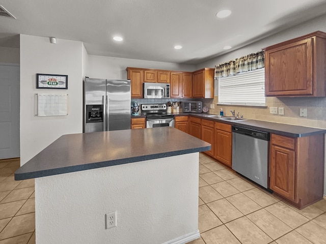 8828 King Ranch Dr, Cross Roads, TX 76227 - kitchen featuring appliances with stainless steel finishes, a sink, dark countertops, and recessed lighting