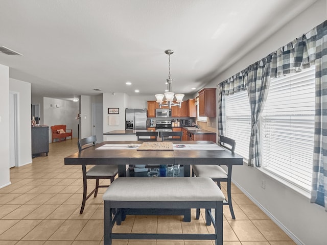 8828 King Ranch Dr, Cross Roads, TX 76227 - dining area with a chandelier, light tile patterned flooring, baseboards, and recessed lighting