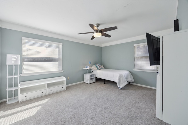 bedroom featuring crown molding, carpet, and baseboards