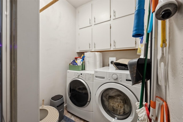 laundry area with cabinet space and separate washer and dryer