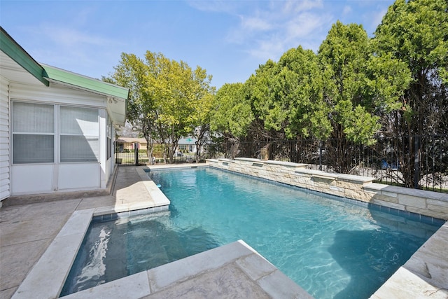 view of swimming pool featuring a fenced in pool and fence