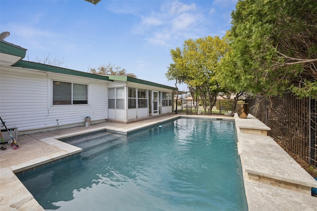 view of swimming pool featuring a fenced in pool, a patio area, and fence