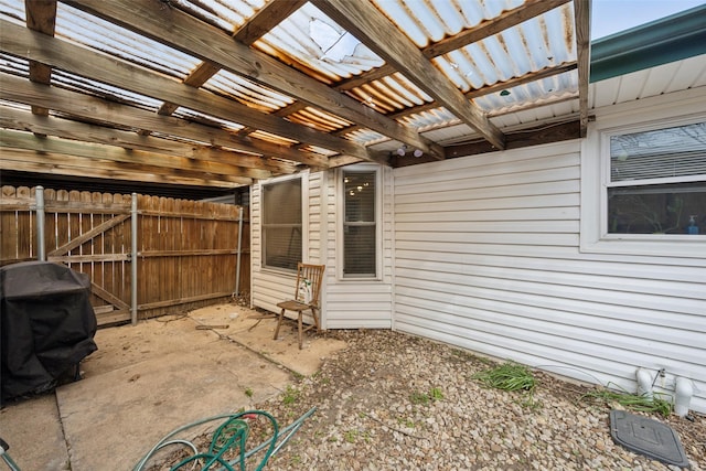 view of patio featuring fence and a pergola