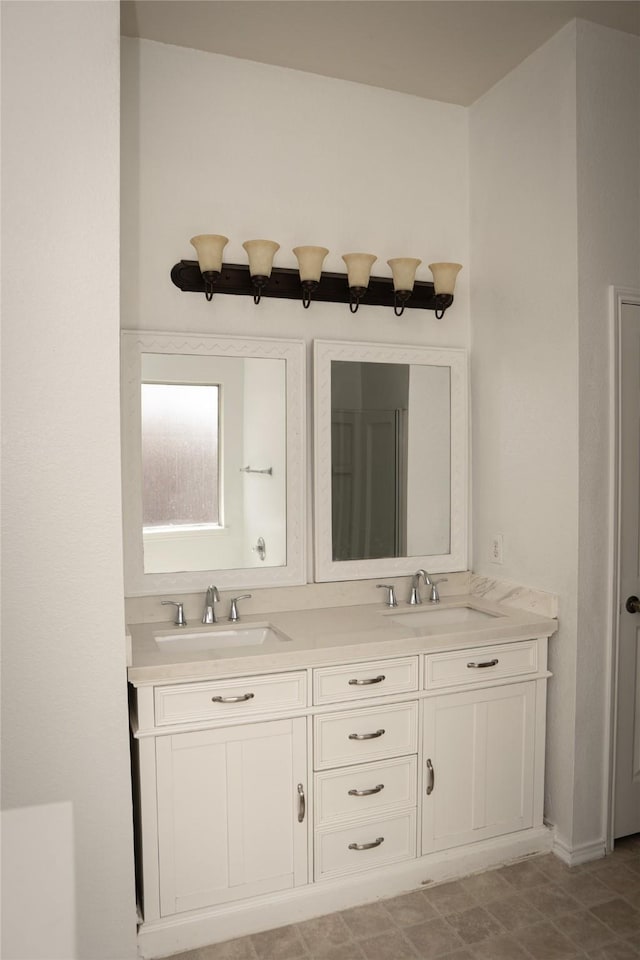 full bath with a sink and double vanity