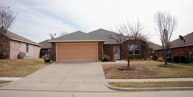 single story home featuring brick siding, driveway, a garage, and roof with shingles