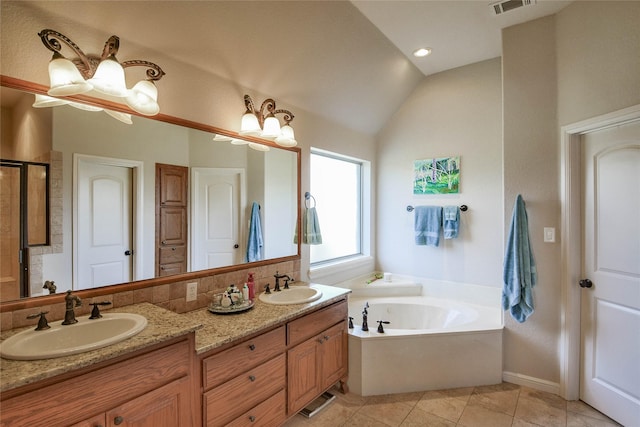 full bathroom with a bath, tile patterned flooring, a shower stall, and a sink