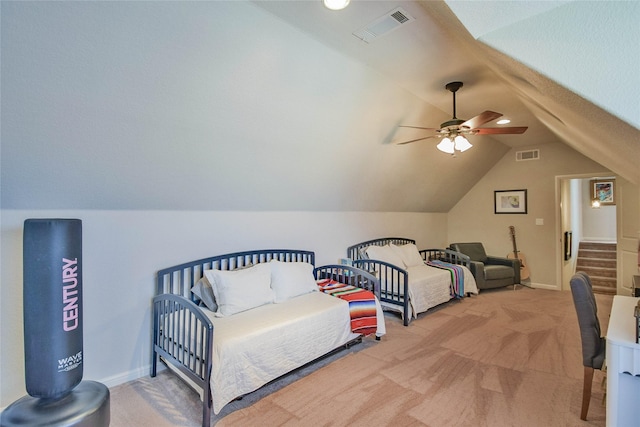 bedroom featuring baseboards, visible vents, light carpet, and lofted ceiling