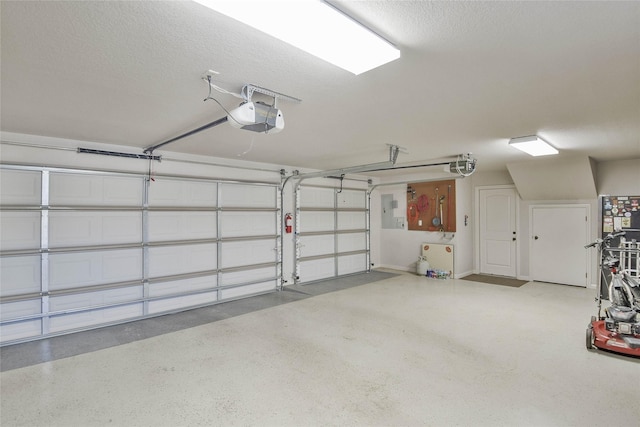 garage with electric panel and a garage door opener