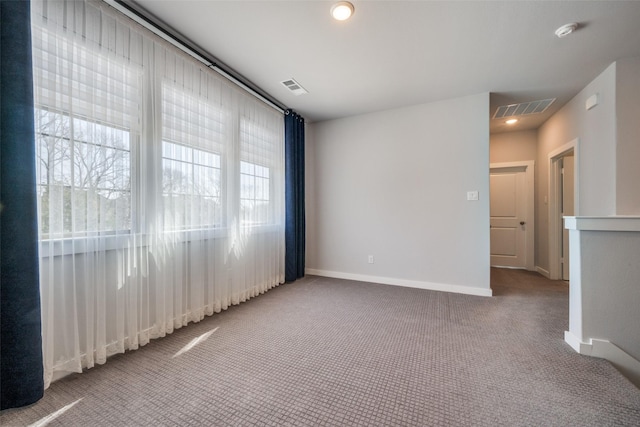 unfurnished room featuring recessed lighting, visible vents, carpet floors, and baseboards