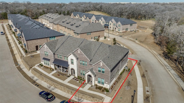 birds eye view of property with a residential view