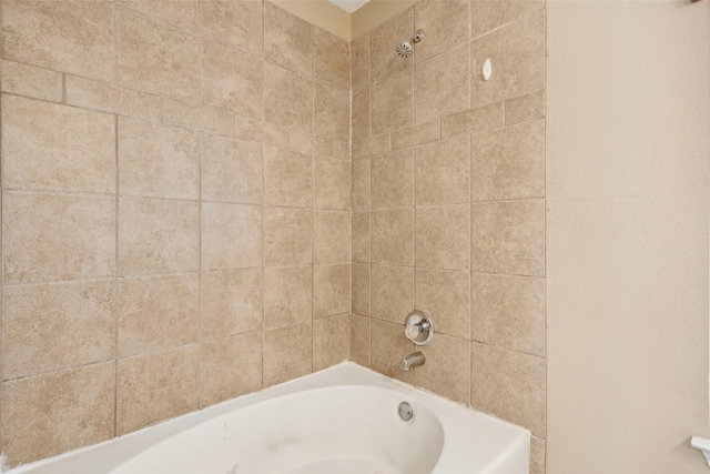 bathroom with shower / washtub combination