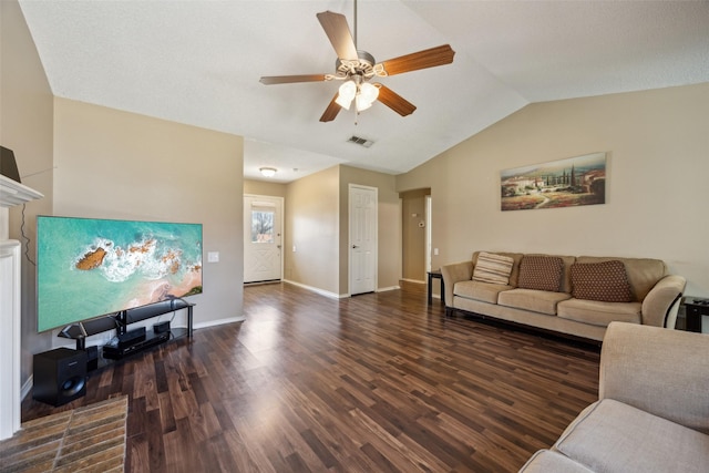 living room with wood finished floors, baseboards, a ceiling fan, visible vents, and vaulted ceiling