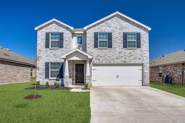 view of front of property featuring a front yard, concrete driveway, central AC, and an attached garage