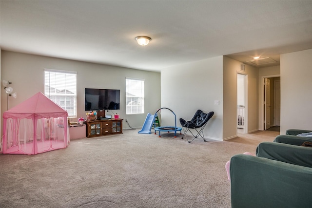 recreation room with visible vents, baseboards, and carpet floors