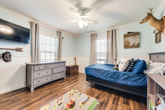 bedroom featuring baseboards, a ceiling fan, crown molding, and dark wood-type flooring