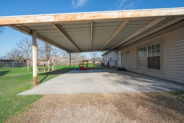 view of patio / terrace featuring an attached carport and a fenced backyard