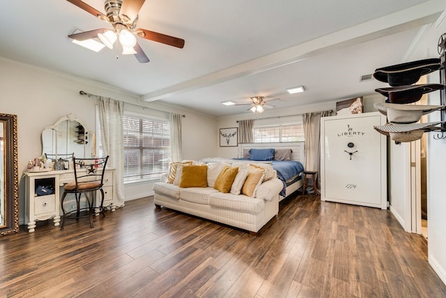 bedroom with beamed ceiling, multiple windows, visible vents, and wood finished floors