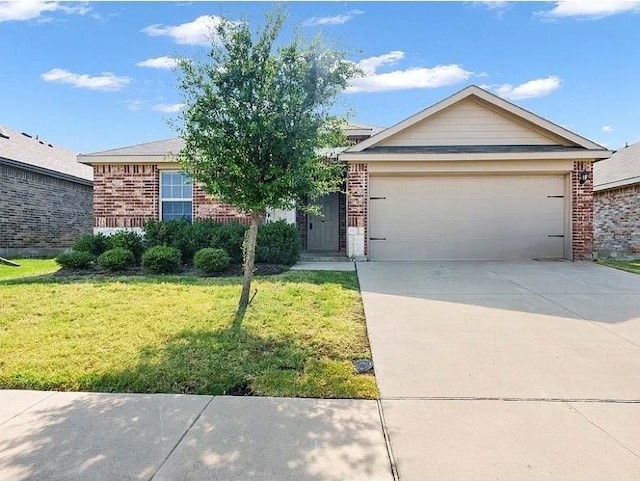 single story home with a front yard, brick siding, an attached garage, and driveway