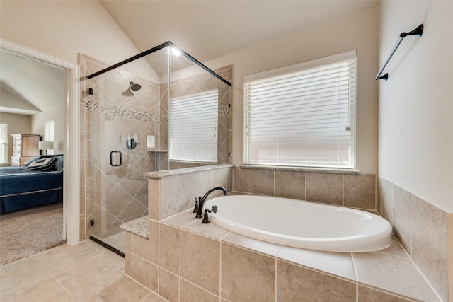 ensuite bathroom featuring a garden tub, a stall shower, tile patterned floors, and connected bathroom