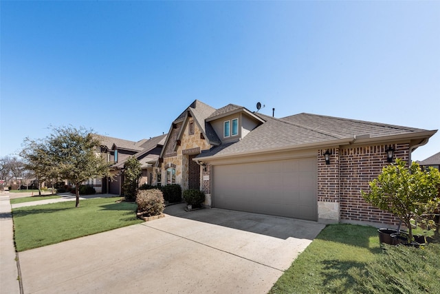 view of front of property featuring driveway, brick siding, an attached garage, and a front lawn